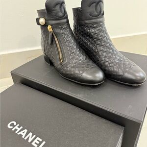 CHANEL Black Quilted Ankle Boots with Gold Accents